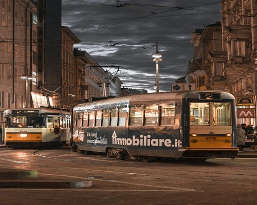 Commuting on a tram in Milan while looking at a smartphone